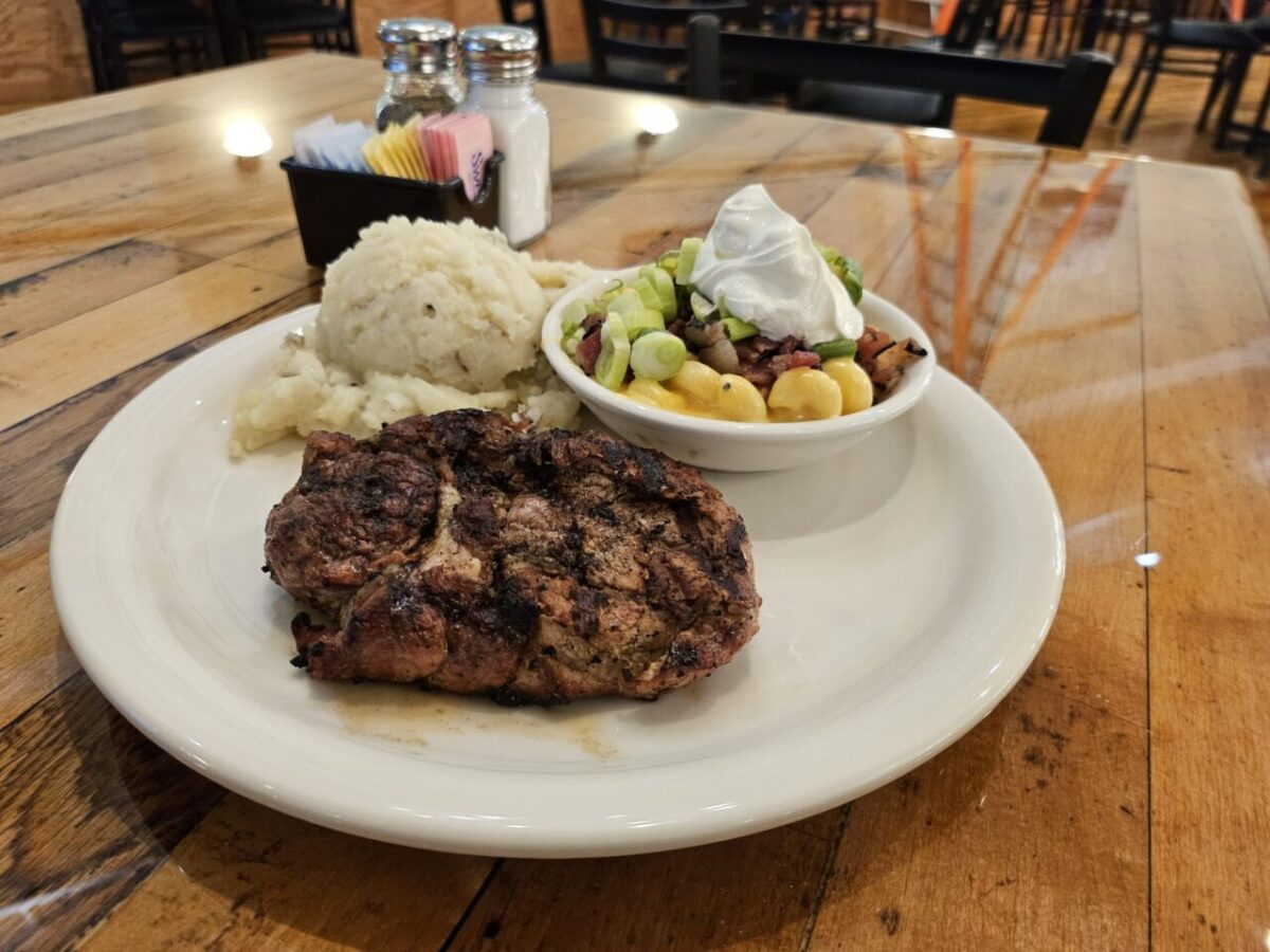 Grilled Pork Ribeye Steak with mashed potatoes and vegetables